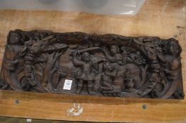 A decorative early carved oak panel.