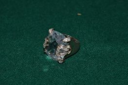 A silver and diamante ring.