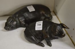 David Selby, two bronze resin pigs.