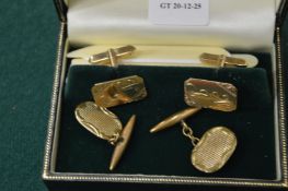 Two pairs of cufflinks.