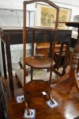 A mahogany folding cake stand.