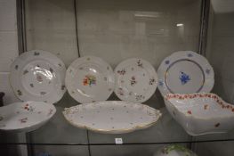A collection of Herend porcelain dishes and plates.