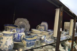 Large collection of Willow pattern and other blue and white porcelain.