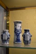 Small Chinese blue and white sleeve vase and two small Chinese blue and white vases.