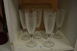 A set of six moulded glass champagne flutes with original box.