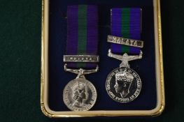 Two miniature medals.