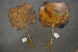 A pair of Victorian papier mache face fans with gilded and painted decoration (faults).