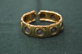 A Carolee coin bracelet.