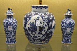 A pair of Chinese blue and white baluster shaped vases and covers together with a blue and white