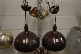 A pair of metal pendant lights.