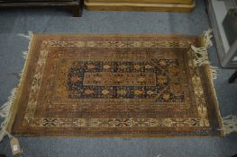 Persian rug, with stylised decoration, moth damage, 132cm x 80cm.