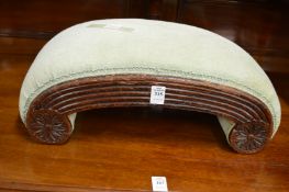 A mahogany framed upholstered foot stool.