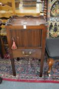 A good pair of Georgian design mahogany bedside cupboards with tambour doors above a small drawer.