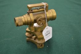 A small brass level.