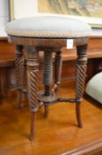A 19th century mahogany revolving music seat.
