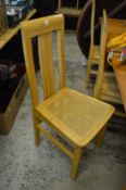 A set of six high back dining chairs.