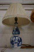 A 19th century Chinese blue and white gourd shaped vase mounted as a lamp, a four character mark