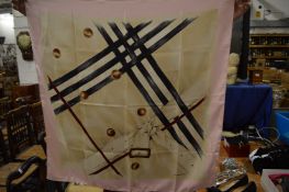 A Burberry silk scarf.