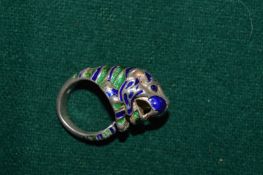 A silver and enamel tiger shaped ring.