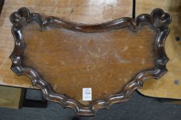 A Chinese hardwood shaped dish with carved decoration.