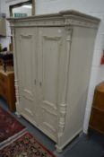 Decoratively painted 19th century French pine two door armoire.
