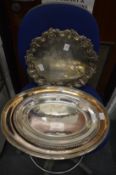 A good plated salver and three plated oval dishes.
