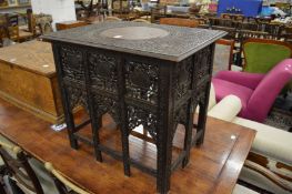 A good Indian carved hardwood rectangular table with folding base, carved and pierced decoration