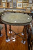 An Eastern brass tray table.