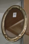 A silver oval photograph frame.