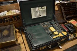 A ladies leather travelling case with lift-out interior compartment.