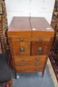 A 19th century mahogany washstand with bi-fold top.