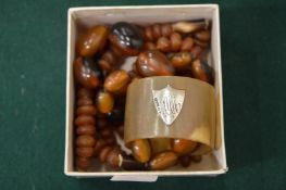 Horn bead necklaces and a napkin ring.