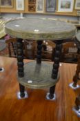 A Chinese brass two-tier occasional table.