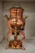 A small copper samovar.