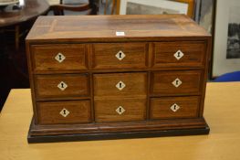 A good 18th/19th century rosewood tabletop chest with heavy brass carrying handles, comprising one
