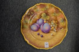 A Royal Worcester cabinet plate painted with plums and other fruit by D Shinnie.