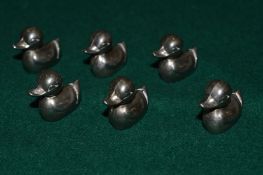 Six duck shaped menu or place name holders.