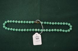 A green bead necklace.