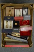 Quantity of ladies wristwatches with original boxes.