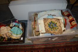 A quantity of unframed tapestries and dolls of the world.