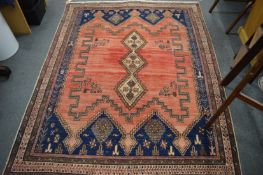 Persian rug, pink ground with stylised decoration, 205cm x 160cm.
