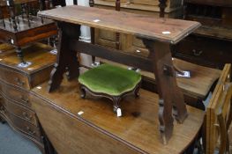 A walnut trestle style bench seat.