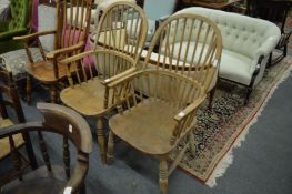 A pair of ash and elm stick back Windsor armchairs, stamped J Elliott & Son.