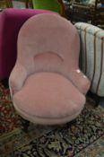 A Victorian pink draylon upholstered nursing chair.
