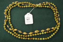 Two decorative bead necklaces.