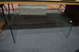 A stylish glass coffee table.