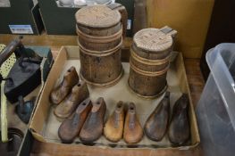 A group of children's wooden shoe lasts and two wooden tankards.