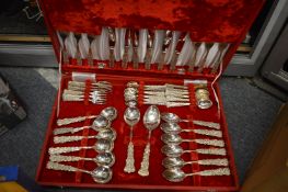 Three cased sets of cutlery.