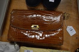 A vintage crocodile leather bag.