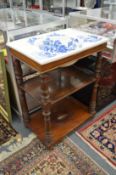 A Victorian washstand with floral blue transfer printed porcelain sink, set into a walnut two-tier